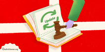 An illustration of a judge’s gavel and a closed book