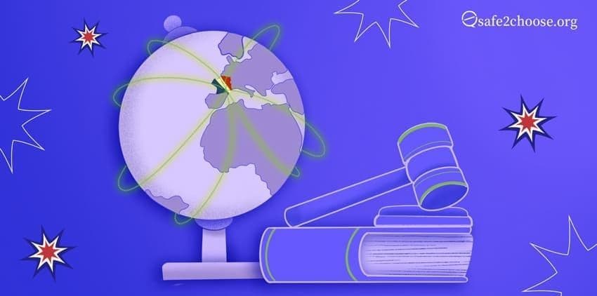 Globo terráqueo con mazo, libros y chispas que simbolizan el derecho al aborto en todo el mundo