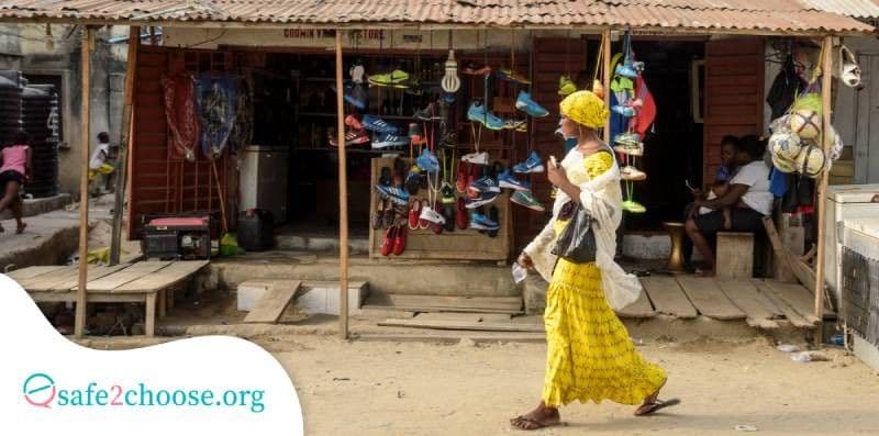 A woman walking in a street within Nigeria